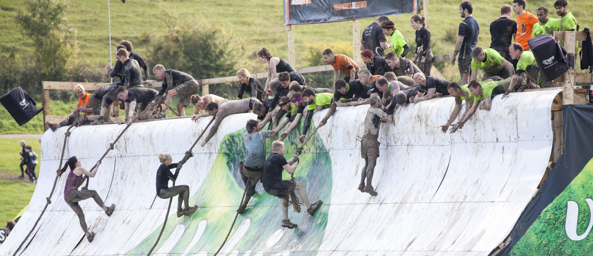 HAMPSHIRE UK - SEPTEMBER 26 2015: Tough Mudder is a team-oriented 18-20 km obstacle course testing strength and mental grit. It is not a timed race but a team challenge with world-class obstacles.